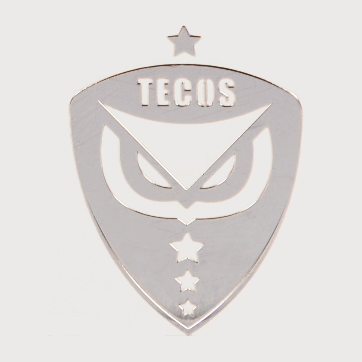 EMBLEMA METÁLICO TECOS – UAG Store